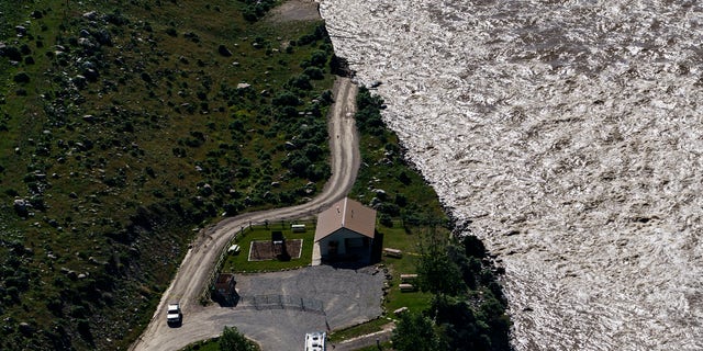 A road ends where floodwaters washed away a house in Gardiner, Mont., Thursday, June 16, 2022. 