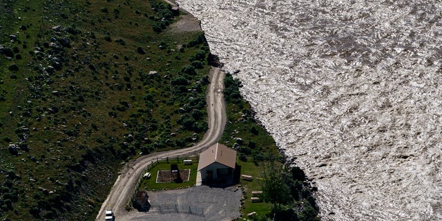 A road ends where floodwaters washed away a house in Gardiner, Mont., Thursday, June 16, 2022. 