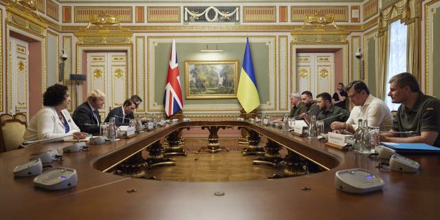 In this image provided by the Ukrainian Presidential Press Office, Britain's Prime Minister Boris Johnson, second left, meets with Ukrainian President Volodymyr Zelenskyy, third right, in Kyiv, Ukraine, Friday, June 17, 2022. (Ukrainian Presidential Press Office via AP)