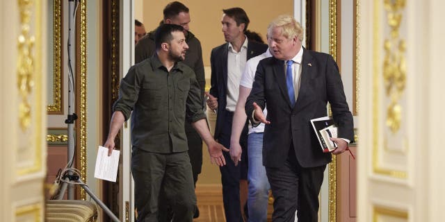 In this image provided by the Ukrainian Presidential Press Office, Ukrainian President Volodymyr Zelenskyy, left, and Britain's Prime Minister Boris Johnson, walk after their meeting in Kyiv, Ukraine, Friday, June 17, 2022. 