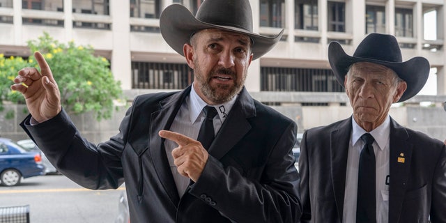 Otero County, New Mexico Commissioner Couy Griffin speaks to reporters as he arrives at federal court in Washington, Friday, June. 17, 2022. 