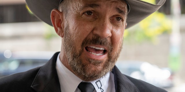 Otero County, New Mexico Commissioner Couy Griffin speaks to reporters as he arrives at the federal court in Washington, Friday, June. 17, 2022. 