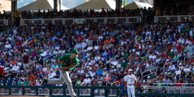 Notre Dame pitcher John Michael Bertrand watches a throw to a Texas batter during the third inning of an NCAA College World Series baseball game Friday, June 17, 2022, in Omaha, Neb.