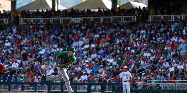 Notre Dame pitcher John Michael Bertrand watches a throw to a Texas batter during the third inning of an NCAA College World Series baseball game Friday, June 17, 2022, in Omaha, Neb. 