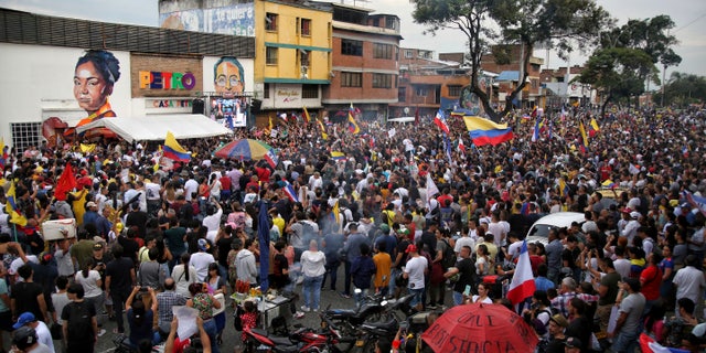 Supporters of presidential candidate of the Historical Pact coalition, Gustavo Petro, celebrate after he won a runoff presidential election in Cali, Colombia, Sunday, June 19, 2022. (AP Photo/Andres Quintero)