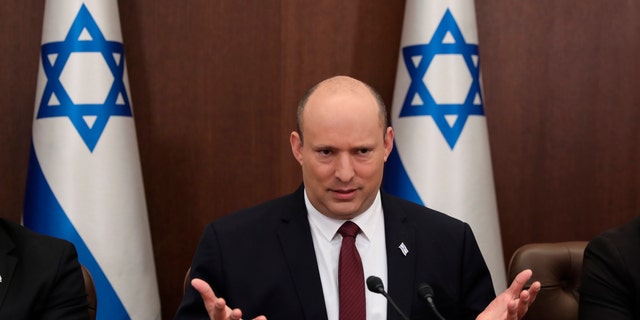 FILE - Israeli Prime Minister Naftali Bennett attends a cabinet meeting at the Prime Minister's office in Jerusalem, Sunday, June 19, 2022. Bennett’s office announced Monday, June 20, 2022, that his weakened coalition will be disbanded and the country will head to new elections. Bennett has struggled to keep his unruly coalition of eight parties together, and defections have left the crumbling alliance without a majority in parliament for over two months. 