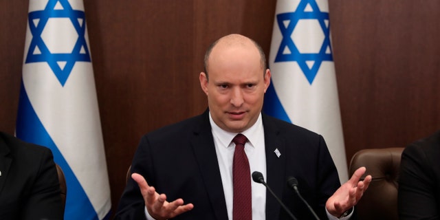 FILE - Israeli Prime Minister Naftali Bennett attends a cabinet meeting at the Prime Minister's office in Jerusalem, Sunday, June 19, 2022. Bennett’s office announced Monday, June 20, 2022, that his weakened coalition will be disbanded and the country will head to new elections. Bennett has struggled to keep his unruly coalition of eight parties together, and defections have left the crumbling alliance without a majority in parliament for over two months. 