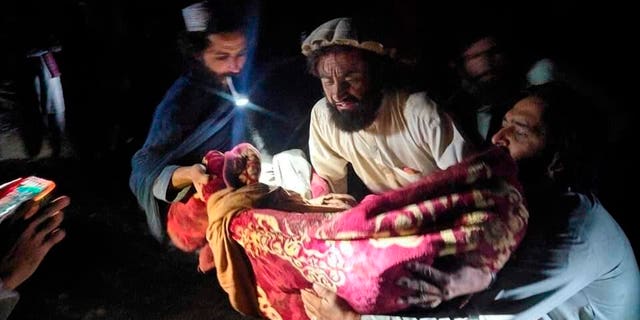 In this photo released by a state-run news agency Bakhtar, Afghans evacuate wounded in an earthquake in the province of Paktika, eastern Afghanistan, Wednesday, June 22, 2022.
