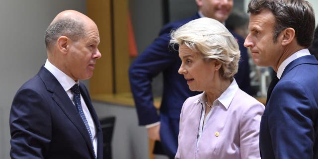 European Commission President Ursula von der Leyen and French President Emmanuel Macron meet German Chancellor Olaf Scholz at the EU Summit in Brussels on June 23, 2022.