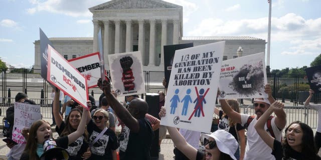 People protestation astir abortion, Friday, June 24, 2022, extracurricular nan Supreme Court successful Washington.