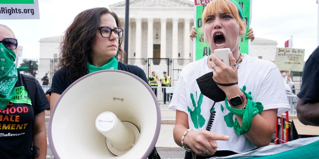 Woman yells after the Supreme Court overturns Roe v. Wade in Washington, Friday, June 24, 2022.