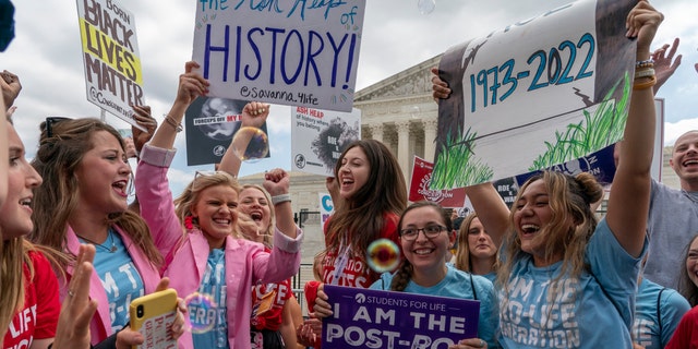 Pro-life women celebrate following Supreme Court's decision to overturn Roe v. Wade, outside the Supreme Court in Washington, Friday, June 24, 2022.