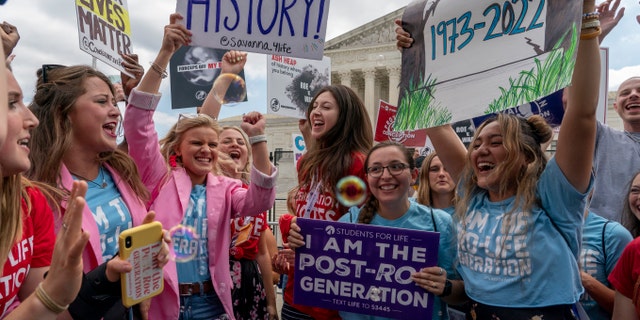 Pro-life women celebrate following Supreme Court's decision to overturn Roe v. Wade, outside the Supreme Court in Washington, Friday, June 24, 2022.