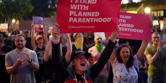 Supporters of abortion rights chant slogans outside a Planned Parenthood clinic during a protest in West Hollywood, Calif. The U.S. Supreme Court's decision to end constitutional protections for abortion has cleared the way for states to impose bans and restrictions on abortion — and will set off a series of legal battles.