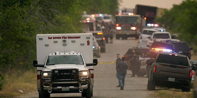 An ambulance leaves the scene where police said dozens of people were found dead in a semitrailer in a remote area in southwestern San Antonio, Monday, June 27, 2022. (AP Photo/Eric Gay)