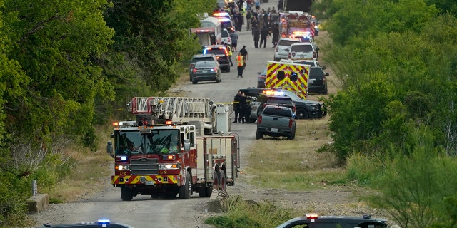 Police block the scene where a semitrailer with multiple dead bodies were discovered, Monday, June 27, 2022, in San Antonio. (AP Photo/Eric Gay)