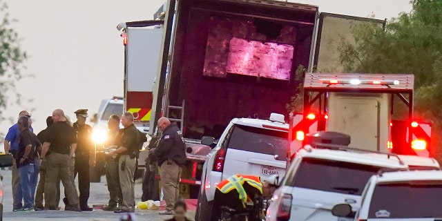 Police and other first responders work the scene where officials say dozens of people have been found dead and multiple others were taken to hospitals with heat-related illnesses after a semitrailer containing suspected migrants was found Monday, June 27, 2022, in San Antonio, Texas.