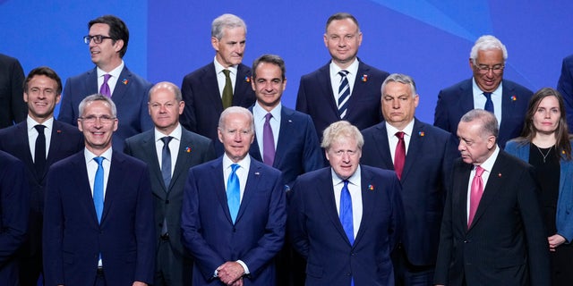 NATO Secretary General Jens Stoltenberg, U.S. President Joe Biden, British Prime Minister Boris Johnson and Turkish President Recep Tayyip Erdogan, front row from left, pose with other leaders for a group photo during the NATO summit in Madrid, Spain, on Wednesday, June 29, 2022. 