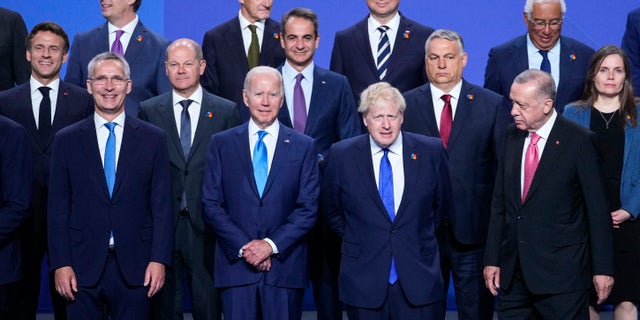NATO Secretary General Jens Stoltenberg, U.S. President Joe Biden, British Prime Minister Boris Johnson and Turkish President Recep Tayyip Erdogan, front row from left, pose with other leaders for a group photo during the NATO summit in Madrid, Spain, on Wednesday, June 29, 2022.