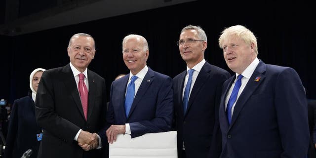 From left, Turkish President Recep Tayyip Erdogan, U.S. President Joe Biden, NATO Secretary General Jens Stoltenberg and British Prime Minister Boris Johnson pose for photographers during a round table meeting at a NATO summit in Madrid, Spain on Wednesday, June 29, 2022. 