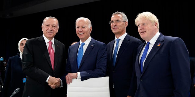 From left, Turkish President Recep Tayyip Erdogan, U.S. President Joe Biden, NATO Secretary General Jens Stoltenberg and British Prime Minister Boris Johnson pose for photographers during a round table meeting at a NATO summit in Madrid, Spain on Wednesday, June 29, 2022.