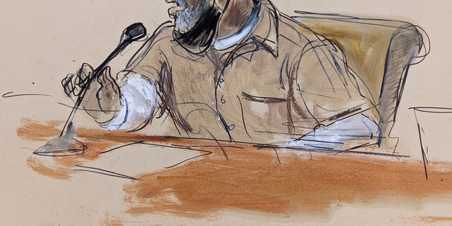 In this courtroom sketch, R. Kelly briefly addresses Judge Ann Donnelly during his sentencing in federal court on June 29, 2022, in New York.