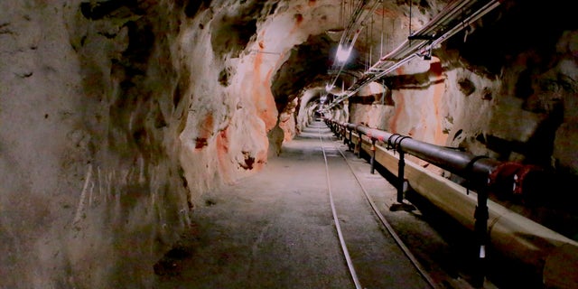 FILE - Overhead lights illuminate a tunnel inside the Red Hill Underground Fuel Storage Facility in Pearl Harbor, Hawaii, on Jan. 26, 2018. A Navy investigation released Thursday, June 30, 2022 revealed that shoddy management and human error caused fuel to leak into Pearl Harbor's tap water last year, poisoning thousands of people and forcing military families to evacuate their homes for hotels. The investigation is the first detailed account of how jet fuel from the Red Hill Bulk Fuel Storage Facility, a massive World War II-era military-fun tank farm in the hills above Pearl Harbor, leaked into a well that supplied water to housing and offices in and around Pearl Harbor.