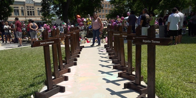 Crosses in Uvalde representing the 21 lives takes in the Robb Elementary School shooting.
