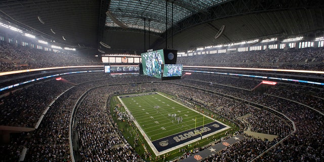 Fans watch at the start of an NFL game inside AT and T Stadium between the New York Giants and Dallas Cowboys Sept. 8, 2013, in Arlington, Texas. 