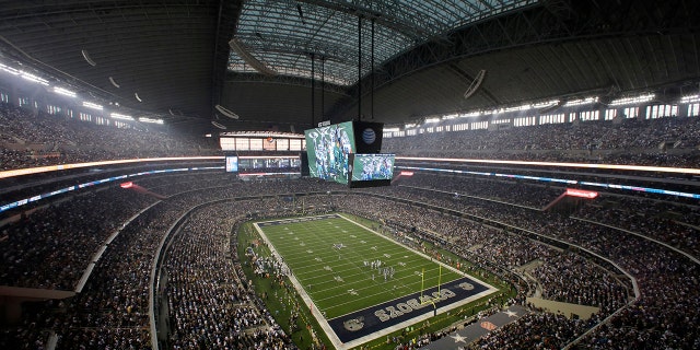 Fans watch at the start of an NFL game inside AT and T Stadium between the New York Giants and Dallas Cowboys Sept. 8, 2013, in Arlington, Texas.