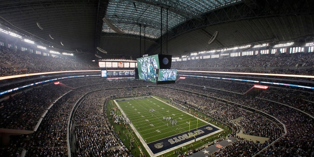 Fans watch at the start of an NFL game inside AT and T Stadium between the New York Giants and Dallas Cowboys Sept. 8, 2013, in Arlington, Texas. 