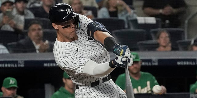 New York Yankees' Aaron Judge singles and scores a runner in the fifth inning of a baseball game against the Oakland Athletics, Monday, June 27, 2022, in New York. 