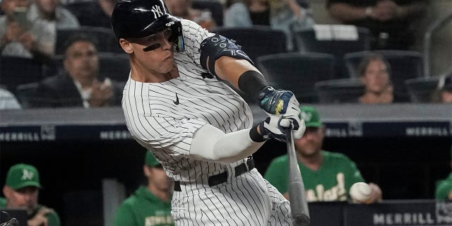 New York Yankees' Aaron Judge singles and scores a runner in the fifth inning of a baseball game against the Oakland Athletics, Monday, June 27, 2022, in New York. 