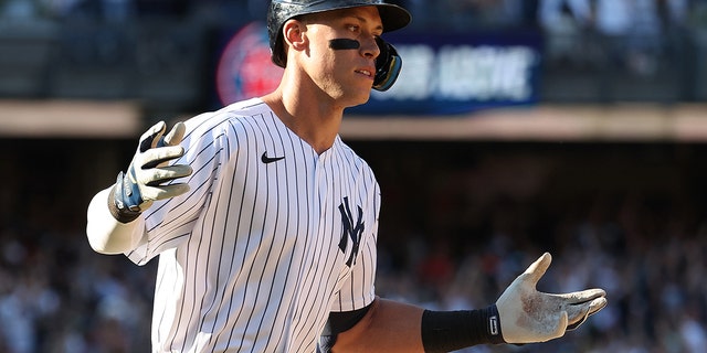 Aaron Judge #99 of the New York Yankees hits a walk off tenth inning three run home run to win the game 6-3 against the Houston Astros during their game at Yankee Stadium on June 26, 2022 in New York City.