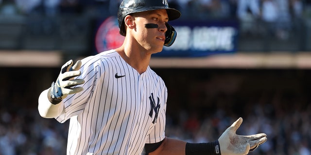 Aaron Judge #99 of the New York Yankees hits a walk off tenth inning three run home run to win the game 6-3 against the Houston Astros during their game at Yankee Stadium on June 26, 2022 in New York City.