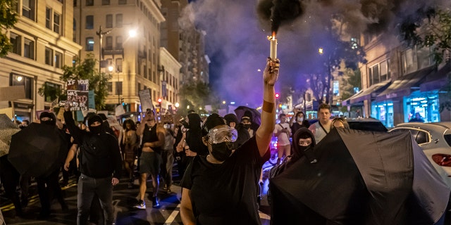 Pro-choice activists gather in protest following the announcement to the Dobbs v Jackson Women's Health Organization ruling on June 24, 2022, in Washington, DC.