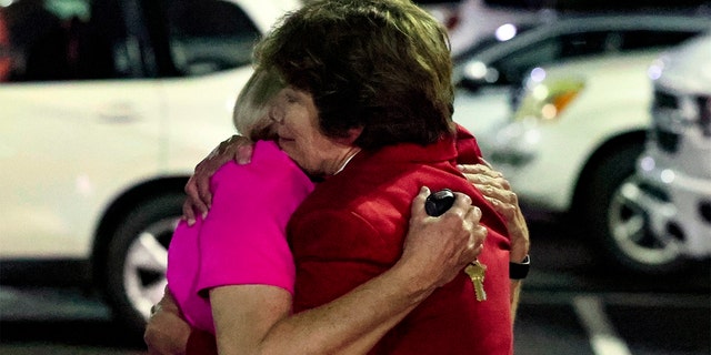 Church members console each other after a shooting at the Saint Stephen's Episcopal Church in Vestavia, AL on June 16, 2022.