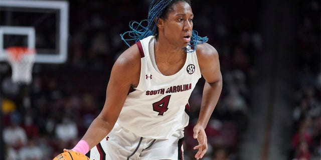 South Carolina forward Aliyah Boston dribbles during the first half of an NCAA college basketball game against Auburn, Feb. 17, 2022, in Columbia, S.C. Boston was named the Collegiate Woman Athlete of the Year on Monday, June 27, 2022.