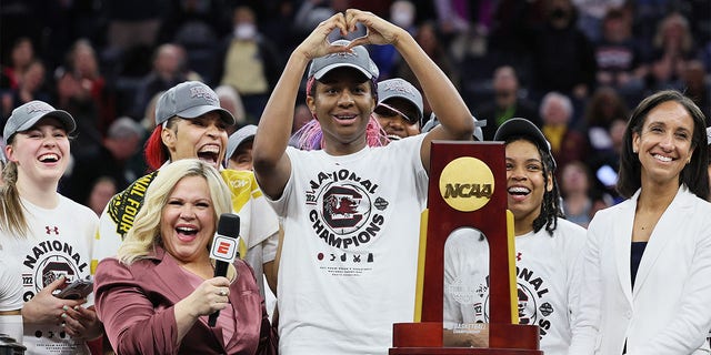 Aliyah Boston of the South Carolina Gamecocks reacts during a National Championship Trophy presentation after defeating the UConn Huskies 64-49 in the 2022 NCAA National Championship game at Target Center on April 3, 2022, in Minneapolis. 