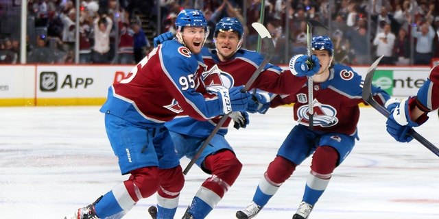 Andre Burakovsky, #95 of the Colorado Avalanche, celebrates with teammates after scoring a goal against Andrei Vasilevskiy, #88 of the Tampa Bay Lightning, during overtime to win Game One of the 2022 Stanley Cup Final 4-3 at Ball Arena on June 15, 2022 在丹佛, 科罗拉多州.
