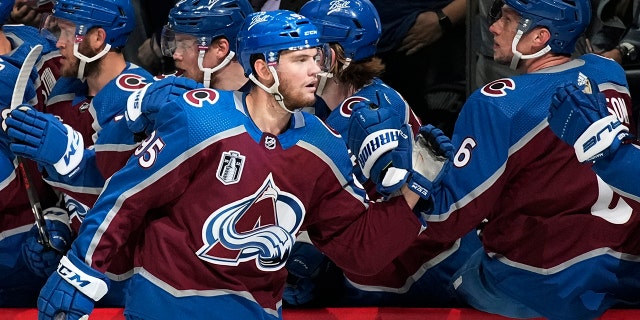 Colorado Avalanche left wing Andre Burakovsky is congratulated for his goal against the Tampa Bay Lightning during the first period in Game 2 of the NHL hockey Stanley Cup Final, Saturday, June 18, 2022, in Denver.