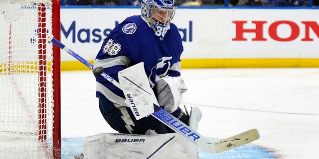 Tampa Bay Lightning goaltender Andrei Vasilevskiy (88) makes a save as he blocks a shot against the New York Rangers during the third period in Game 4 of the NHL Hockey Stanley Cup playoffs Eastern Conference finals Tuesday, June 7, 2022, in Tampa, Fla.