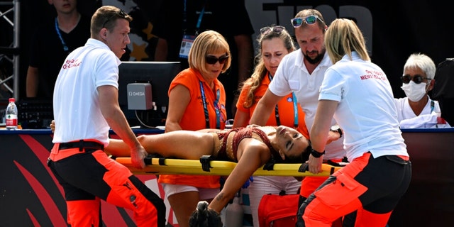 Anita Alvarez of United States is carried on stretcher after collapsing during the solo free final of the artistic swimming at the 19th FINA World Championships in Budapest, Hungary, Wednesday, June 22, 2022. 