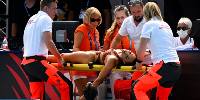 Anita Alvarez of United States is carried on stretcher after collapsing during the solo free final of the artistic swimming at the 19th FINA World Championships in Budapest, Hungary, Wednesday, June 22, 2022.