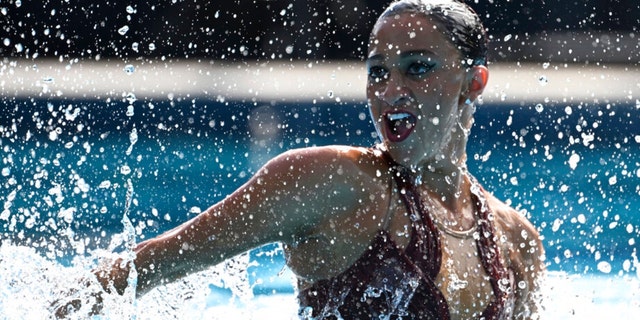 Anita Alvarez of United States competes before collapsing during the solo free final of the artistic swimming at the 19th FINA World Championships in Budapest, Hungary, Wednesday, June 22, 2022. Alvarez collapsed in the pool during her routine and had to be rescued. 