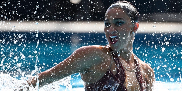 Anita Alvarez of United States competes before collapsing during the solo free final of the artistic swimming at the 19th FINA World Championships in Budapest, Hungary, Wednesday, June 22, 2022. Alvarez collapsed in the pool during her routine and had to be rescued. 