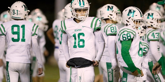 High School Football: Isidore Newman Arch Manning (16) with teammates during game vs Cohen School at Pan American Stadium. New Orleans, LA.