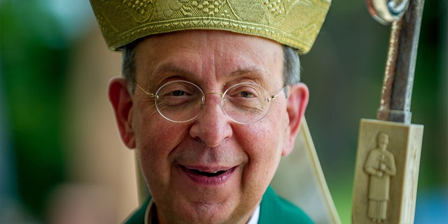 FILE - Archbishop William Lori, head of the Archdiocese of Baltimore, greets parishioners after delivering Sunday Mass at Holy Family Catholic Church on July 14, 2019, in Randallstown, Maryland. 