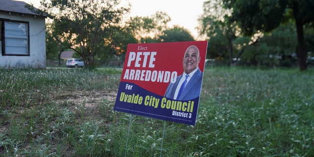 A political sign for Pete Arredondo, the Uvalde School District police chief, who is scheduled to be sworn in with the Uvalde City Council is seen in Uvalde, Texas, U.S. May 29, 2022. 