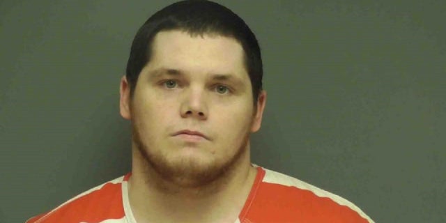 Austin Patrick Hall, 26, was arrested after an hours-long manhunt following the shooting of two Alabama sheriff's deputies, one of whom died, authorities said. 